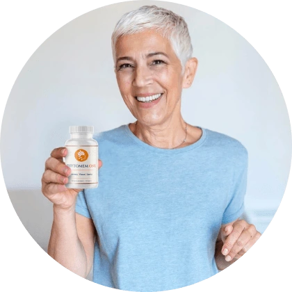 Woman in a blue top holding a bottle of Phytomem One