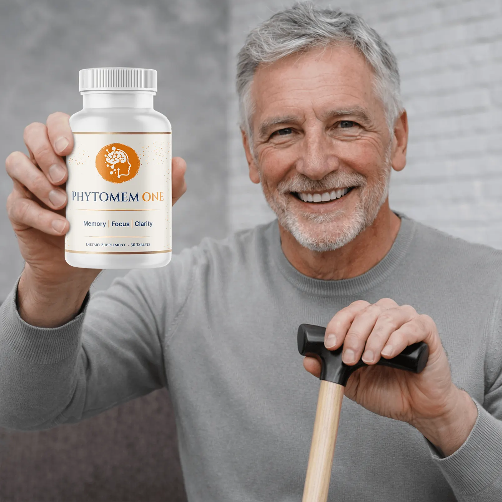 Older man smiling and holding a bottle of Phytomem One